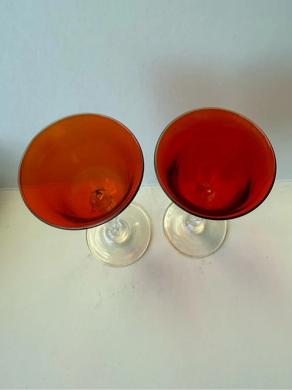 Vintage Pair of Orangy Red Apertif Glassware with Clear Twisted Stems.